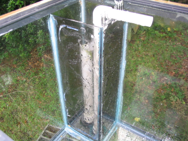 Here you can see the overflow box and the removable strainer at the top (took the front one off for the pic). To mee the slate are too big and I would ramke 2 custom ones with smaller slate if I kept it. Was working fine as is though.